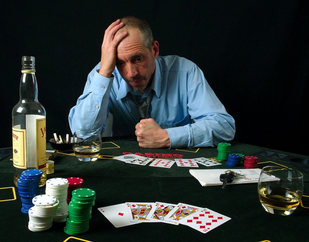 Person looking anxious at a slot machine